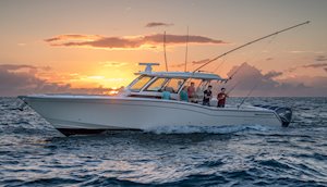 Grady-White Canyon 456 45-foot center console fishing boat running at sunset