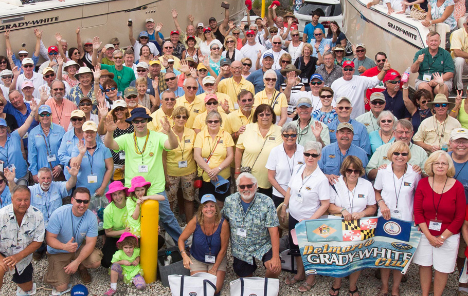 A large group of Grady Club members gathered in front of Grady-White boats.