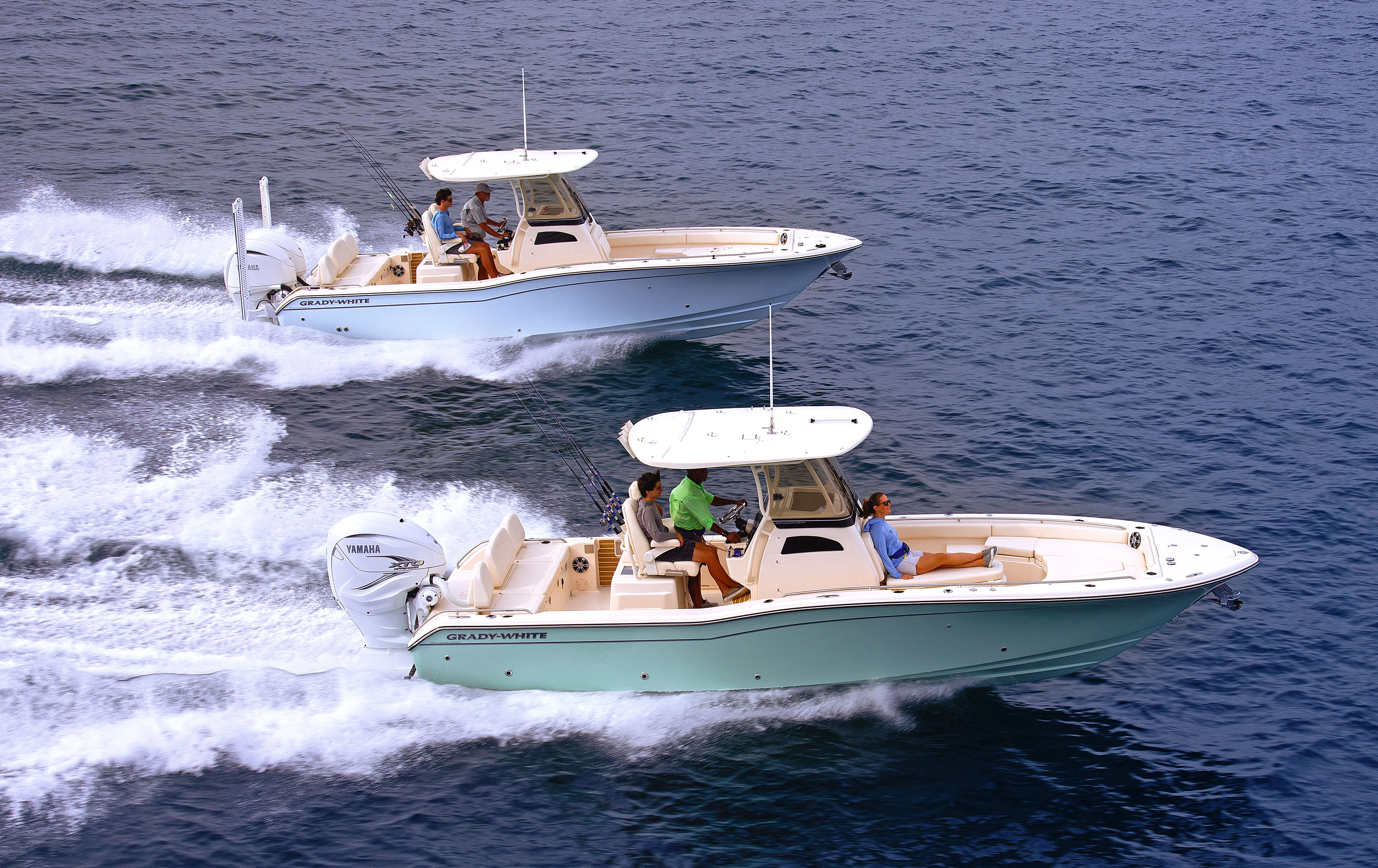 Two Grady-White 281 CE 28-foot coastal explorer boats running starboard side