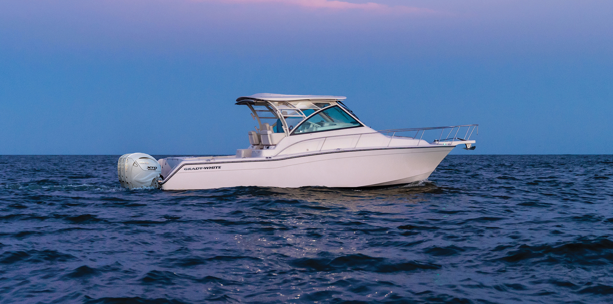 Express 370 Grady White 37 Foot Express Cabin cruising by moonlight