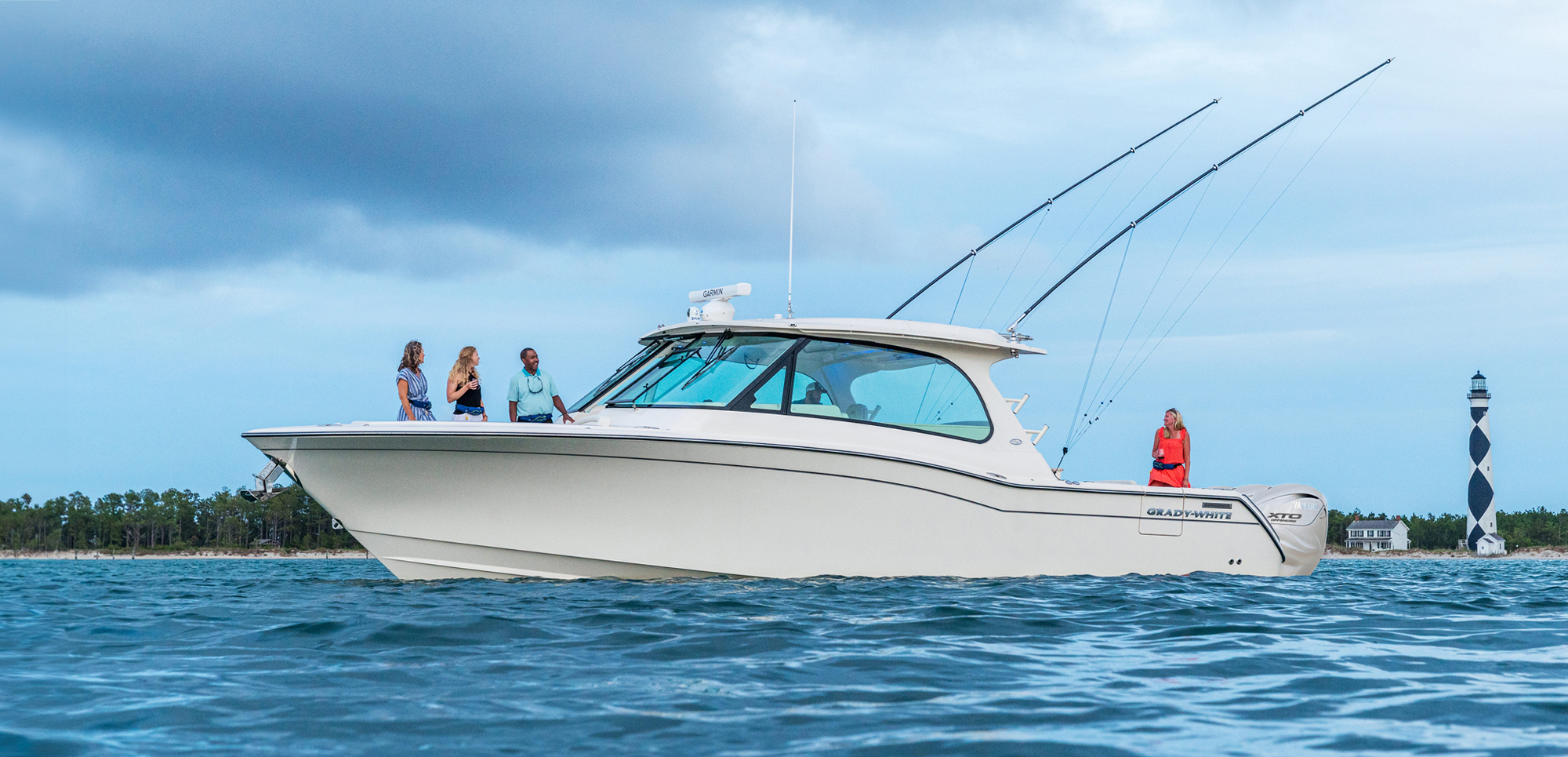 Freedom 415 port side people on deck near Cape Lookout lighthouse