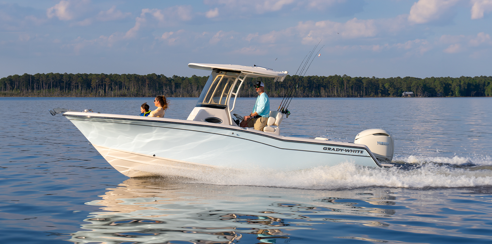 Beautiful Ocean Mist Grady-White Fisherman 236, a 23-foot center console port side running.