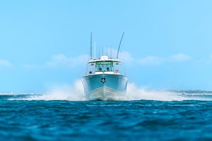 Grady-White Canyon 306 30-foot center console boat running straight on