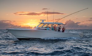 Grady-White Canyon 456 45-foot center console fishing boat running at sunset