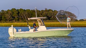 Grady-White 251 CE 25-foot Coastal Explorer fishing boat throwing net