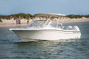 Grady-White Freedom 255 25-foot dual console boat port side with family on beach