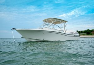 Grady-White Freedom 255 25-foot dual console boat beach port side