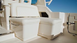 Electromechanically extendable companion lounge seat on the Grady-White Freedom 345 dual console boat