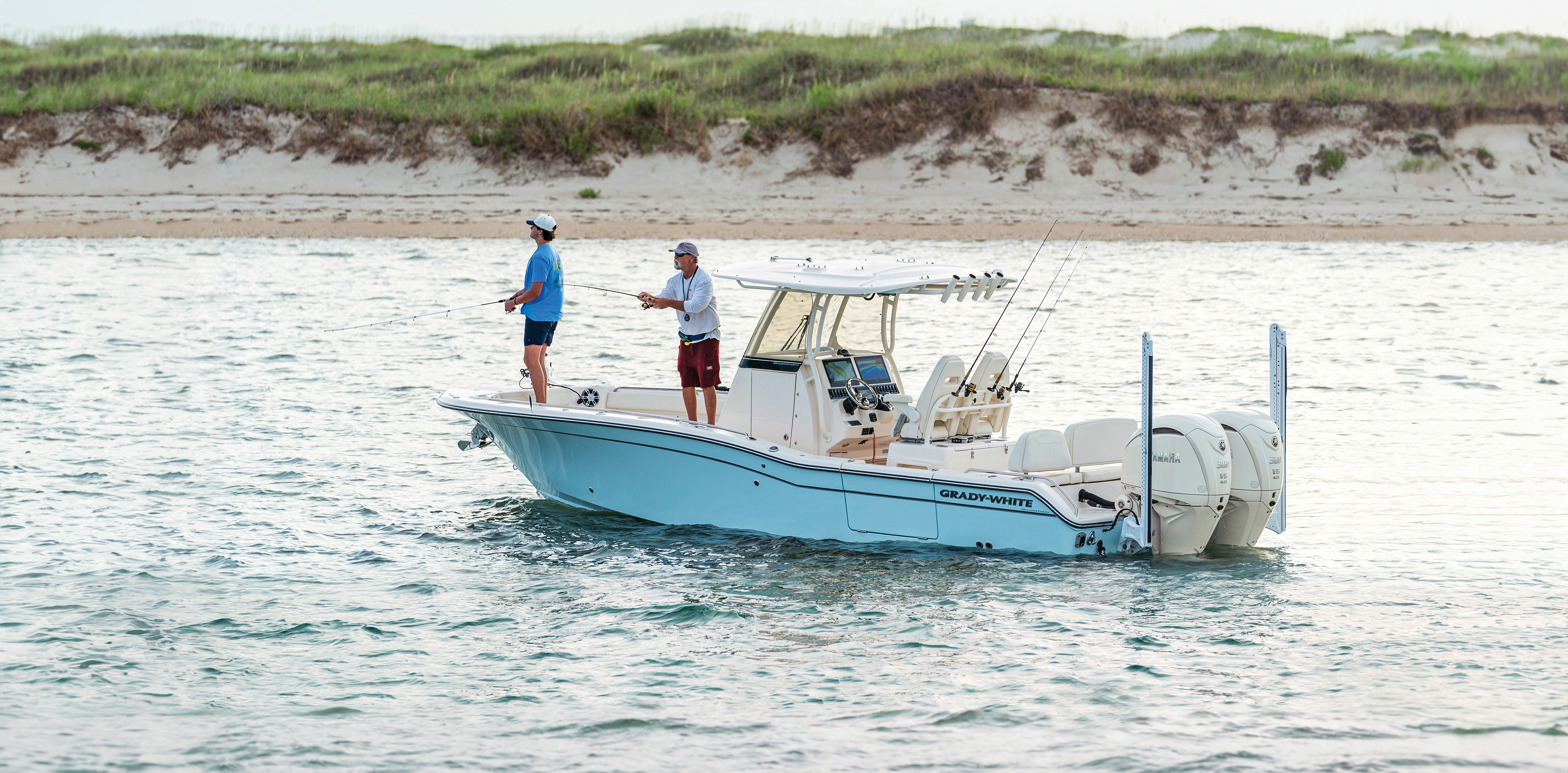 Grady-White 281 CE Coastal Explorer boat with two people fishing from bow