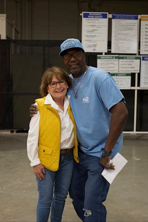 Man and woman posing for camera