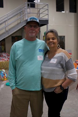 Man and woman posing for camera
