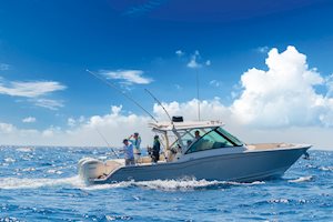 Grady-White Freedom 325 dual console boat fishing with starboard side showing