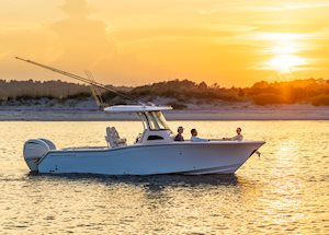 Grady-White Canyon 271 27-foot center console boat starboard side colorful sunset