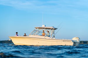Grady-White Freedom 285 28-foot dual console port side people relaxing