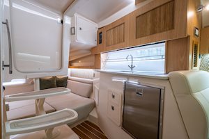 Grady-White Boats Express 340 33-foot Express Cabin boat cabin interior showing galley and aft berth